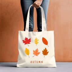 Welcome to my shop!  Embrace the cozy vibes of autumn with our beautifully handcrafted Fall Tote Bag featuring a charming fall-themed design. Perfect for carrying your essentials, this tote is made from durable, high-quality canvas, ensuring it's both stylish and practical for everyday use. Whether you're heading to the farmers market, running errands, or just need a chic accessory for the season, this tote is a must-have. The fall-inspired design captures the essence of the season with whimsical leaves, and warm colors, making it the perfect accessory to showcase your love for fall. It also makes a thoughtful gift for friends and family who appreciate unique, handcrafted items. Returns or Exchanges: - All of our Tote Bags are custom printed just for you. So we do not accept returns or exc Whimsical Leaves, Family Tote Bag, Fall Tote Bag, Fall Tote, Thanksgiving Family, Cozy Autumn, Autumn Vibes, Cozy Vibes, Autumn Cozy