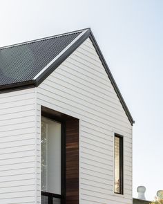 a white house with a wooden door and window