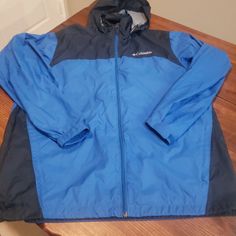 Nwot No Signs Of Wear Columbia Windbreaker Jacket In A Size Medium. Warm And Insulted Very Well Blue Windbreaker For Fall Outdoor Activities, Hooded Blue Outerwear For Hiking, Blue Hooded Jacket With Pockets For Hiking, Blue Long Sleeve Outerwear For Outdoor Activities, Blue Long Sleeve Outerwear For Outdoor, Blue Windbreaker With Pockets For Cold Weather, Blue Hooded Jacket For Fall Outdoor Activities, Blue Long Sleeve Windbreaker For Outdoor Activities, Blue Hooded Jacket For Outdoor