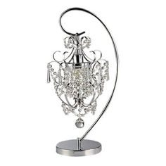 a chrome and crystal chandelier on a metal stand with a circular base,