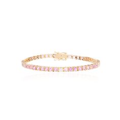 Indulge in the exquisite beauty of our Large Pink Sapphire and Diamond Bracelet that elevates any attire with its alluring charm. This timeless piece of jewelry is the epitome of elegance and adds a touch of sophistication to your wrist. The intricate craftsmanship and delicate design of this bracelet make it a perfect addition to your jewelry collection. 14K Yellow Gold3 Round Brilliant White Diamonds at 0.27 Carats Total Weight50 Round Pink Sapphires at 5.80 CaratsBracelet Measures: 7.25 inche Delicate Design, D F, White Diamonds, Diamond Gemstone, Pink Sapphire, Round Brilliant, Diamond White, Jewelry Care, Timeless Pieces