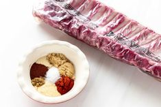 two bowls with different types of food in them next to an empty container filled with meat