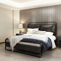 a bedroom with a bed, nightstands and two lamps on either side of the bed