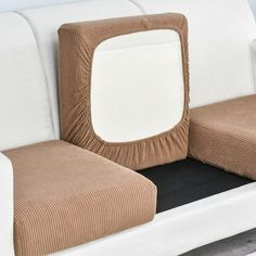 a close up of a couch with a square shaped cushion on the back and sides