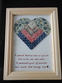 a frame with a quilted heart in the center and a poem written on it