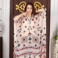 "Lace Up silk kaftan beach party dress embellished kaftan silk kaftan tunic hand made kaftan for sale embroidered kaftan silk dress 437 Lace Up Centre front digitally printed Ethnic Geometric Print over Pure Silk Kaftan of full length and styled side splits With the celestial Geometric Print kaftan as inspiration. Geometric patterns on silk kaftan are welcomed on any occasion regardless of the event. Long Lace Up kaftan is effortlessly Elegant. This Plus size Silk kaftan dress features lace up c Silk V-neck Kaftan For Beachwear, Bohemian V-neck Kaftan For Eid, Bohemian Long Thobe For Eid, Flowy Festive Kaftan, Festive Beach Kaftan With Kimono Sleeves, Bohemian Style Tunic Thobe For Eid, Festive Vacation Kaftan With Kimono Sleeves, V-neck Thobe For Eid Vacation, Festive Bohemian Maxi Thobe