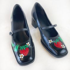 Hand painted leather mary jane black Bandolino shoes with adjustable buckles on the straps. Painted with strawberry florals  a tole painting cottagecore style. 1 Pair only. Size 8.5 US Women's. Purchased at thrift but are like new. All items are carefully sourced with a keen eye for quality, comfortability, material, and style. Hand-painted with acrylic-based Jacquard Neopaque Leather Paints and coated with Angelus acrylic finisher. Water resistant.  *These do NOT have any undesirable odor. All items are inspected, sanitized, and deodorized prior to painting.   Smoke-free home and shop. Cleaning is best done with a damp cloth and a light wipe down. Inch measurements: Length (heel to toe): 10.25" Width (ball of foot): 3.5" Heel height: 2" Join the preloved revolution with responsible fashio Strawberry Print Clothes, Vintage Mary Janes With Heel Strap, Strawberry Mary Janes, Vintage Leather Mary Janes With Heel Strap, Summer T-strap Mary Janes With Buckle Closure, Painting Cottagecore, Black Leather Shoes Women, Bandolino Shoes, Cottagecore Style