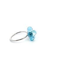 SIZE 6.5 READY TO SHIP Forget-Me-Not Ring, a stunning piece of artistry that captures the delicate beauty of the forget-me-not flower in every detail. Crafted with exquisite precision and adorned with approximately 6.25 carat briolette cut aquamarine stones. Nestled in a bed of luxurious 18K white gold the aquamarine stones shimmer with a mesmerizing azure hue reminiscent of a clear spring sky. Each stone is carefully selected and expertly arranged to mimic the gentle petals of the forget-me-not Blue Flower Rings For Formal Occasions, Elegant Flower Shaped Crystal Ring, Elegant Flower Charm Promise Ring, Delicate Flower Shaped Jewelry With Brilliant Cut, Elegant Promise Ring With Flower Charm, Delicate Flower Shaped Jewelry With Prong Setting, Delicate Flower-shaped Jewelry With Prong Setting, Flower Shaped Ring With Prong Setting For Formal Occasions, Elegant Blue Sterling Silver Flower Ring