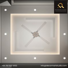 a ceiling with lights and a clock on it