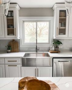 the kitchen counter is clean and ready to be used as a centerpiece for the sink