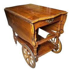 an old wooden cart with wheels on it