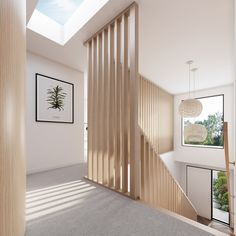 an empty room with wooden slats on the wall and stairs leading up to it