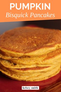 stack of pumpkin biscuit pancakes on a red plate with text overlay that reads, how to make pumpkin biscuit pancakes