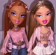 two dolls are standing next to each other with pink lipstick on their lips and one has her mouth open