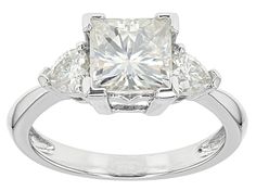 Pre-Owned Moissanite Fire® 2.56ctw diamond equivalent weight square brilliant and heart shape, Platineve® ring. Measures 5/16" L x 1/16" W and is not sizeable. Actual moissanite weight is 2.30ctw. Comes with certificate of authenticity..  This product may be a customer return, vendor sample, or on-air display and is not in its originally manufactured condition.  It may not be new.  In some instances, these items are repackaged by JTV. Gia Certified Square Cut Diamond Anniversary Ring, Gia Certified Square Cut Diamond Ring For Anniversary, White Square Cut Moissanite Ring, Gia Certified Square Cut Moissanite Diamond Ring, Gia Certified Trillion Cut Ring In Diamond White, Gia Certified Trillion Cut Cubic Zirconia Ring, White Moissanite Trillion Cut Diamond Ring, White Trillion Cut Moissanite Diamond Ring, White Trillion Cut Cubic Zirconia Diamond Ring