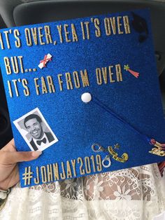 a blue graduation cap that says it's over, but it's far from over