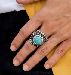 A refreshing turquoise stone is pressed into the center of a round silver frame bordered by shiny silver studs for a rustic look. Features a stretchy band for a flexible fit.

Sold as one individual ring. Turquoise Fashion, Blue Stone Ring, Paparazzi Accessories, Turquoise Rings, Paparazzi Jewelry, Trendy Accessories, Shiny Silver, Blue Rings, Silver Frame