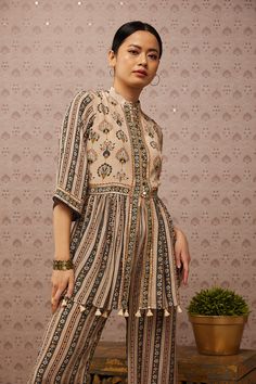 Editor's Note Beige Sarouk Embroidered Kurta With Palazzo Color: Beige Fabric: Top & Bottom : Crepe Care: Dry Clean Only About the Designer Soup by Sougat Paul The brand has stood out for its Offbeat state-of-the-art and prints with unique mixing of colors, in silhouettes made to embrace and celebrate Feminity. It aspires to cater to that perfect ensemble to every woman who wishes to endorse beauty /Feminity/confidence and a dash of eccentric quirk all put together. Kurta With Palazzo, Beige Fabric, Every Woman, Saree, Celebrities, Pattern, Fabric, Beauty, Color