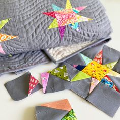 the quilts are laying next to each other on the table