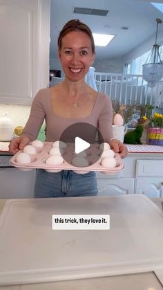 a woman holding a tray with eggs on it in her hands and the caption says, this trick, they love it