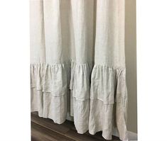 a curtain with ruffles hanging from it's side