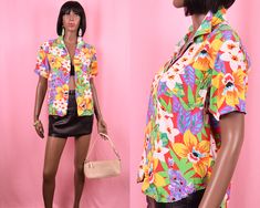 "Super cute short sleeved button up shirt with bright colorful tropical flower print, seven front buttons, and left chest pocket. Authentic vintage item from the 1990's era. Flat Measurements: BUST- 20\" SLEEVE- 8\" LENGTH- 23\" Fits size: SMALL BRAND: Lizwear Petites Excellent condition. Shop our entire shirt collection HERE: https://www.etsy.com/shop/AlleysVintage?section_id=16181985" 90s Top, Flower Print Shirt, Tropical Flower, Flower Shirt, Shirt Collection, Cute Shorts, Short Sleeve Button Up, Tropical Flowers, Floral Top