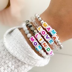 "Brand new to the Louis and Finn shop -- how FUN are these custom beaded name bracelets with colorful square letters! All bracelets are a colorful mixture of pastel letter beads on a chunky square as shown. You just pick the style of the band: silver, crystal, leopard or white marble! Use your name, initials, your kiddos, pet names, motivation words, phrases -- options are endless! These also make perfect gifts for -- mamas to be, baby shower, bridal, bachelorette party, best friends, etc. ≫ PRO Trendy Custom Name Beaded Bracelets For Mother's Day, Trendy Mother's Day Beaded Bracelets With Custom Name, Trendy Beaded Bracelets With Letter Beads For Birthday, Trendy White Name Bracelet For Mother's Day, Trendy White Stretch Bracelet With Letter Print, Trendy Rectangular Beaded Bracelets As Gift, Casual Letter Beads Stretch Bracelet For Mother's Day, Trendy Rectangular Beaded Bracelets For Gifts, White Custom Name Letter Bracelets