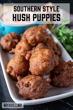 some fried food on a white plate with sauce and parsley in the background text reads southern style hush puppies