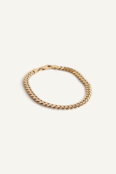 In some cultures, gold bracelets or anklets are given to newborns. They are known to bring luck and great fortune, or to protect one against evil spirits. In reminiscence of Jennie's gold ID bracelet that she received from her grandmother, this bracelet is a modern take on a vintage piece from the 80's. Chain links are not entirely flat and have a rounded texture for a comfortable fit.Lobster clasp closure. In the second image, model is wearing the Hampshire House Bracelet, Capri Curb Chain Brac Italian Gold Chain, Hampshire House, Italian Gold Jewelry, Cuban Bracelet, Fall Rings, Gold Baroque, Bar Stud Earrings, Star Pendant Necklace, Solid Gold Chains