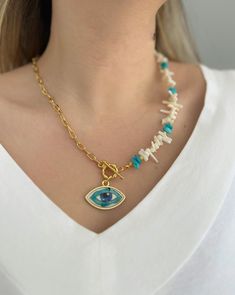 Dainty Evil Eye Necklace Gold Chain * Coral beaded necklace *  Evil eye jewelry * Evil eye pendant * Everyday necklace * summer necklace Embark on a journey of style and protection with this stunning handmade dainty evil eye necklace. The intricate craftsmanship brings out the essence of elegance, while the captivating blue evil eye pendant serves as a symbol of warding off negativity and attracting positive energy.  Elevate your ensemble and make a powerful fashion statement with this enchanting coral beaded summer necklace . Ideal for everyday wear or special occasions, this extraordinary crystal evil eye necklace is destined to become a cherished treasure. Embrace the beauty and protective powers of the evil eye, and let this remarkable evil eye protection necklace radiate its captivati White Bohemian Necklace With Evil Eye, Bohemian White Necklace With Evil Eye Detail, Bohemian White Evil Eye Necklace, Bohemian Evil Eye Jewelry For Vacation, Unique Evil Eye Necklace For Gift, Powerful Fashion, Jewelry Evil Eye, Diy Leather Earrings, Necklace Evil Eye