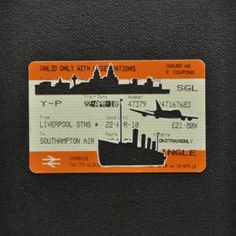 an orange and white luggage tag with a ship on it's side, in front of a black background