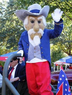 a man in a patriotic outfit waving to the crowd