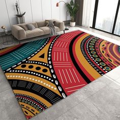 a colorful area rug in the middle of a living room