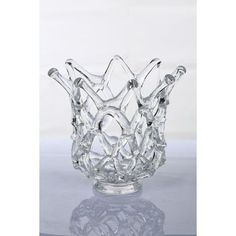 a clear glass vase sitting on top of a table