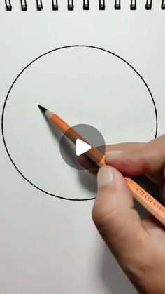 someone is drawing a circle with a pencil