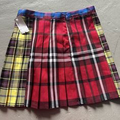 Plaid Multicolored Skirt With One Cargo Pocket And Cute Details On The Pocket. Never Worn. Nwt Red Pleated Skirt For School In Spring, Red Skort For School In Spring, Casual Plaid Skirt With Patchwork, Red Mini Skirt For School In Summer, Fitted Multicolor Mini Skirt For School, Relaxed Fit Multicolor Mini Skort, Multicolor Mini Skirt Bottoms For School, Retro Multicolor Cotton Skort, Multicolor Spring Skirt For School