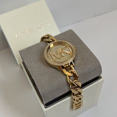 Mk Watch Box Included Mk3474 Slim Runway Gold Tone St Steel Glitz Chain Bracelet Women's Watch Sku: Mk3474 Case Size: 38mm Movement: Three Hand Platform: Slim Runway Strap Material: Stainless Steel Water Resistance: 5 Atm Case Color: Gold Case Material: Stainless Steel Dial Color: Gold Strap Width: 14mm Mk Gold Watch Women, Timeless Gold Watch With Chain Detail, Gold Timeless Watch With Chain Detail, Timeless Gold Watch With Chain, Classic Gold Chain Watch, Timeless Gold Chain Watch, Formal Gold Chain Watch, Luxury Metal Diamond Watch For Gift, Luxury Metal Diamond Watch Gift