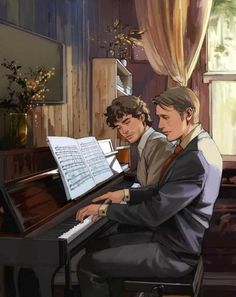 two young men sitting at a piano playing music