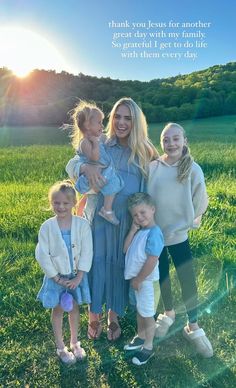 a woman and her four children standing in the grass with an inspirational quote on it