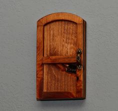 a wooden door with a handle on the wall