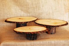 three slices of wood sitting on top of a table