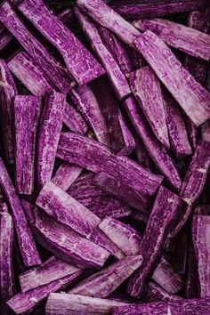 close up view of purple sweet potato slices in a pile, ready to be cooked