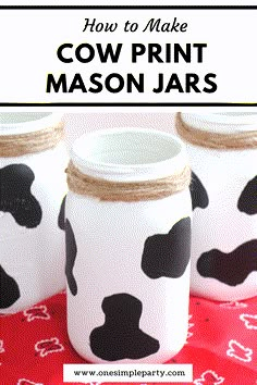 three mason jars decorated with black and white cow prints on red fabric, text overlay says how to make cow print mason jars