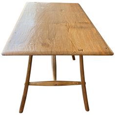 a wooden table with two legs and a square shaped top, on a white background