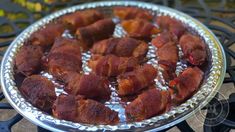 there are many pieces of meat in the bowl on the stove burner, ready to be cooked