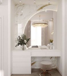 a white vanity with a mirror and stool in a room that has marble walls and flooring