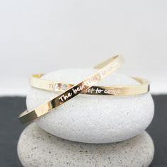 Introducing our gorgeous custom-made gold cuff bracelet, engraved with the inspiring phrase "The Best Is Yet To Come." This powerful message serves as a reminder to stay positive and keep moving forward, knowing that your best days are still ahead of you. In addition to its stylish appearance, this bracelet is also a powerful tool for manifesting your dreams and goals. By wearing this bracelet, you are setting an intention for the best to come into your life, and attracting positive energy and a Attracting Positive Energy, Gold Cuff Bracelet, The Best Is Yet To Come, Gold Bracelet Cuff, Gold Cuffs, Keep Moving Forward, Stay Positive, Keep Moving, Jewelry Outfit