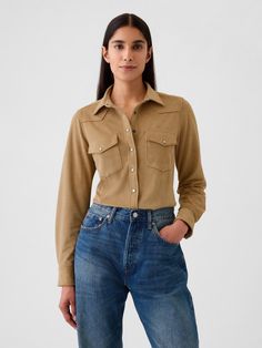 Soft, stretch vegan suede shirt.  Point collar, snap button front.  Long sleeves.  Patch pockets at front.  Allover Western detailing.  Fit: Close to the body.  Hits at the hip.  Models wearing Gap Camel Shirt, Tan Jeans, Women Shirt Top, Jean Shirt, Fashion Mistakes, Style Mistakes, Western Shirt, Western Shirts, Jean Shirts