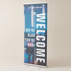 a sign that says we are welcome to you're here in blue and white