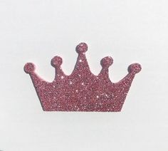 a pink glittered crown on a white background